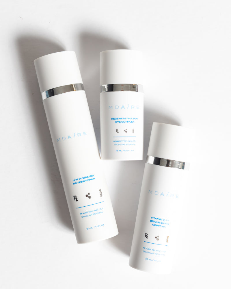 Brightening Trio featuring sleek white bottles with silver accents highlighting hydration and brightening benefits gallery 1