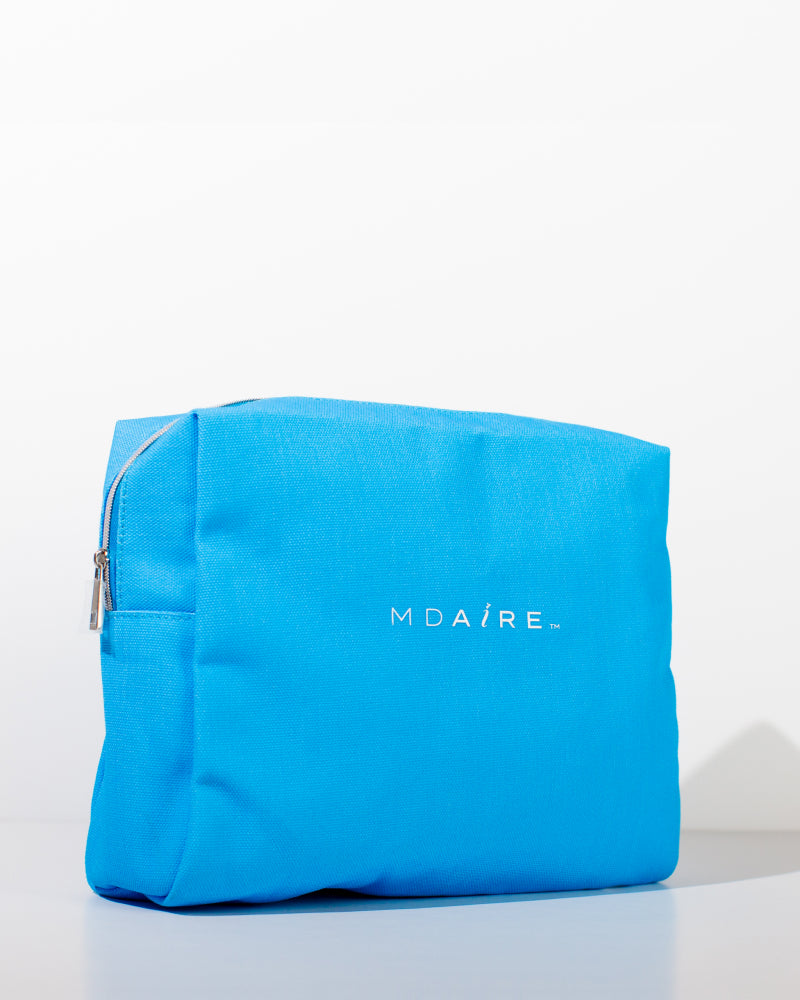 Glow on the Go Bundle with MDAiRE mini skincare products and bright blue cosmetic bag in gallery position 1