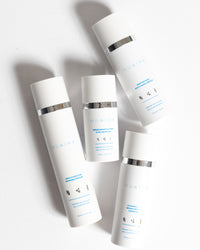 Daily Skincare Bundle by MDAiRE with white minimalist bottles shown in gallery position 1 against a clean background