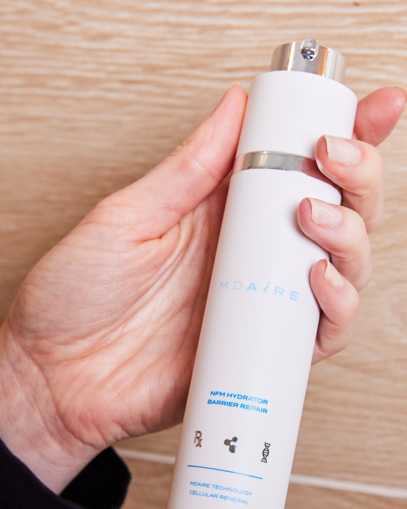 Hand holding NMF Hydrator Barrier Repair by Dr. Stefani Kappel for daily hydration and barrier strengthening, Healthy Skin From Within
