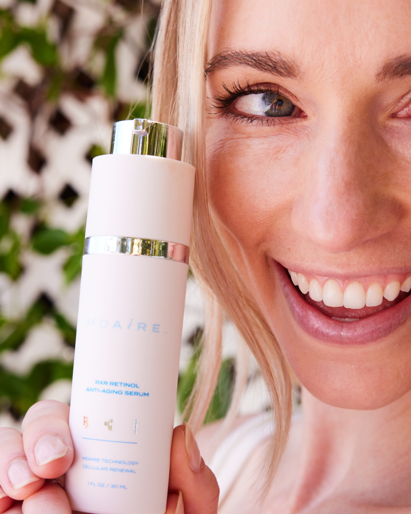 Smiling woman showcasing RXR Retinol Anti-Aging Serum by Dr. Stefani Kappel for Healthy Skin From Within and skin renewal
