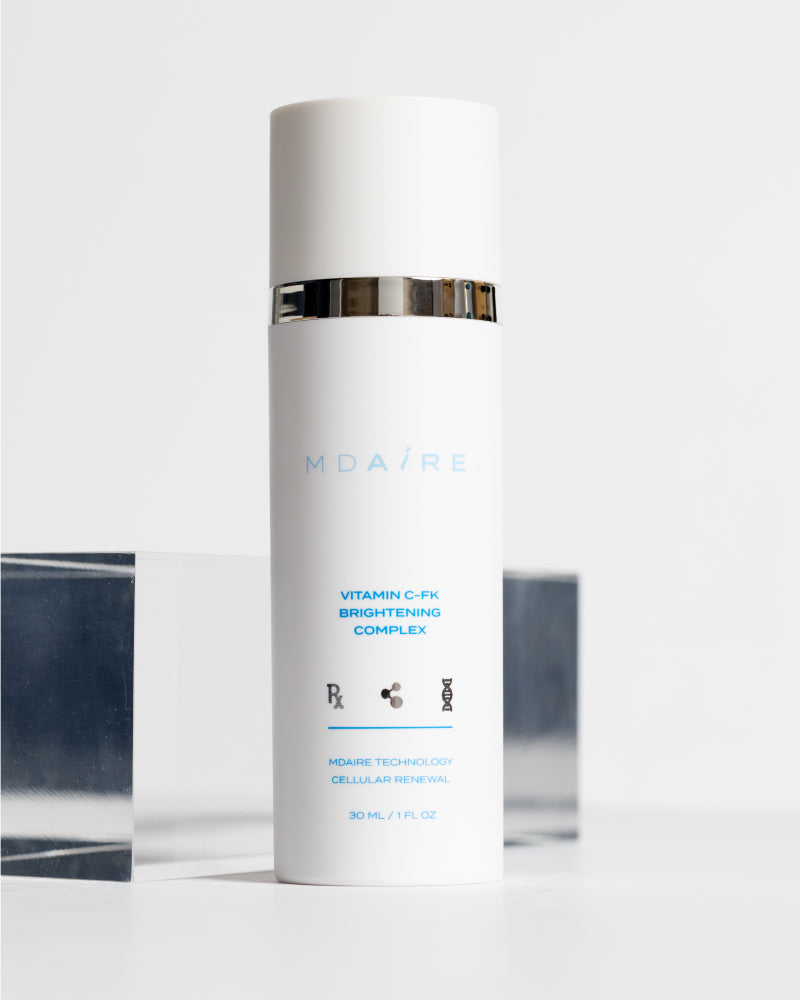 Brightening Trio featuring white bottle with silver band showcasing Vitamin C-FK formula gallery position 1