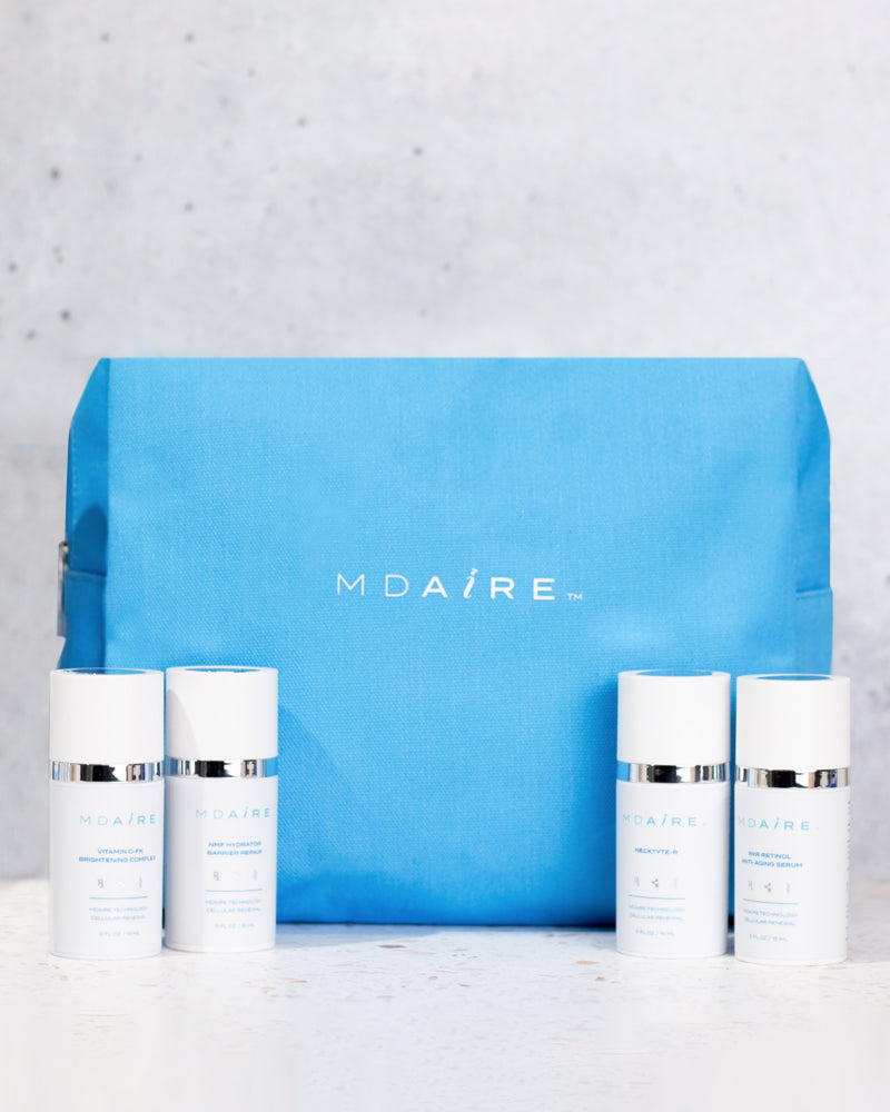 Glow on the Go Bundle with MDAiRE mini skincare products and bright blue cosmetic bag in gallery position 1