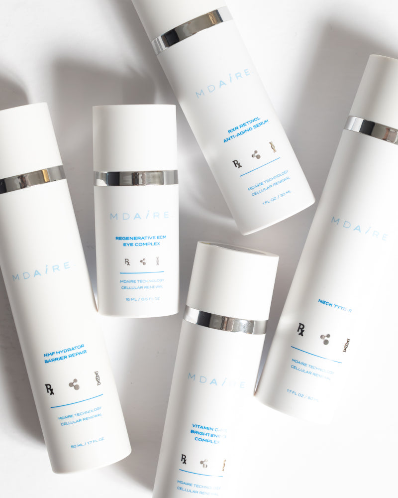 Skincare Essentials Bundle featuring sleek white bottles with silver accents highlighting advanced MDAiRE formulas gallery 1