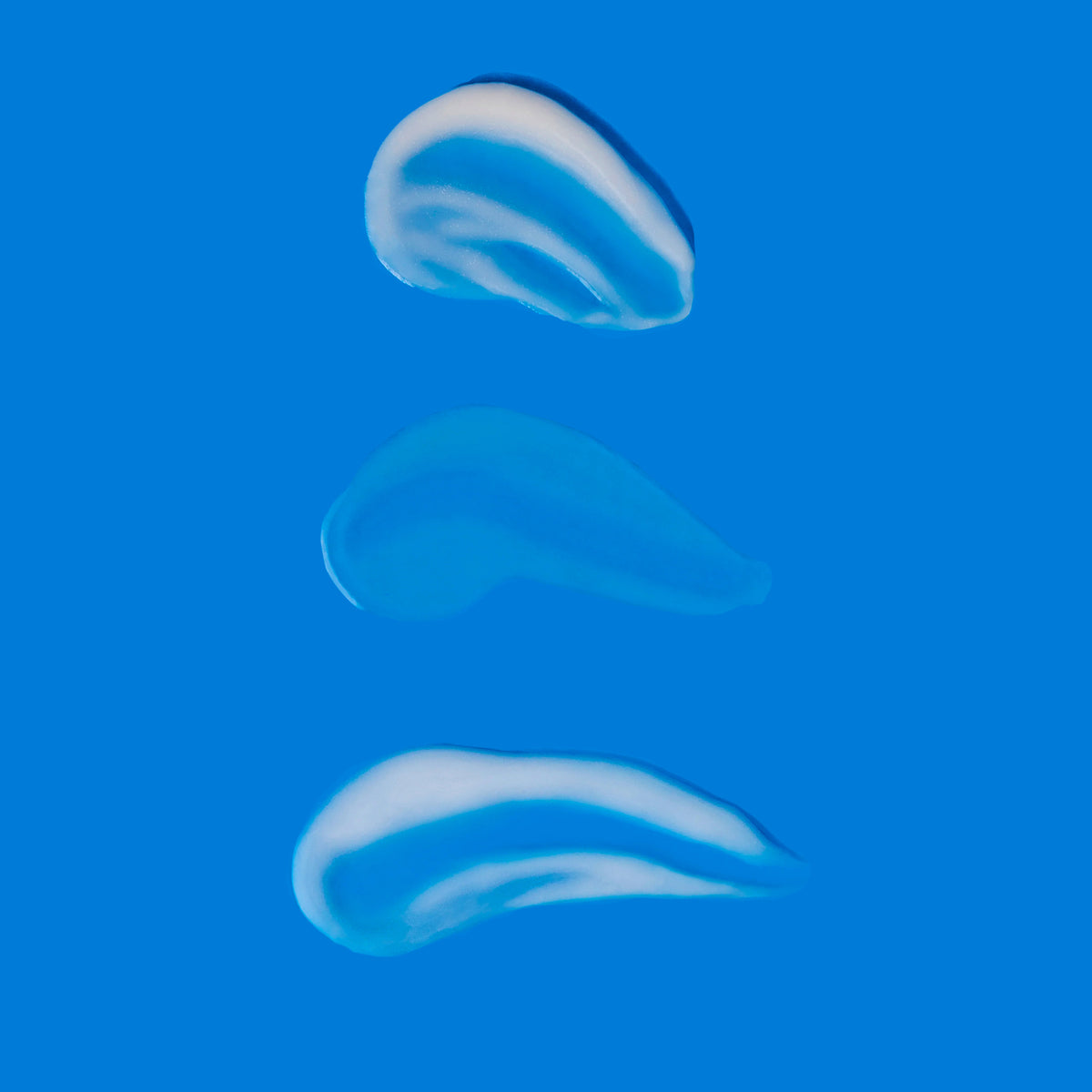 Brightening Trio product textures on blue background showing hydration and brightening effects gallery position 1