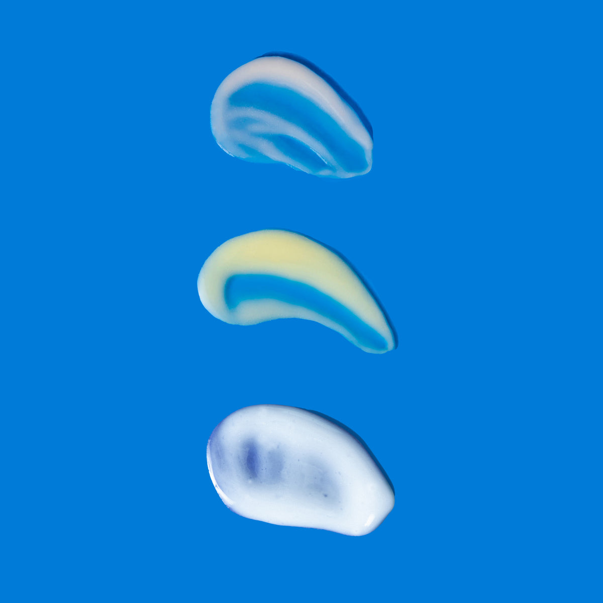 Three distinct cream textures from Triple Threat Trio displayed on blue background gallery position 1